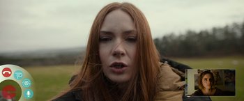 Movie still from “The Circle” (2017), directed by James Ponsoldt – A person with long red hair; Close Up shot, High angle