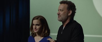 Movie still from “The Circle” (2017), directed by James Ponsoldt – A man and a woman standing next to each other; Medium shot, Over the shoulder angle