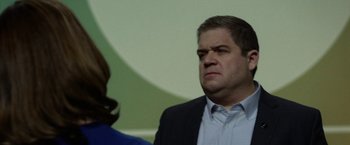 Movie still from “The Circle” (2017), directed by James Ponsoldt – A man and a woman standing next to each other; Close Up shot, Over the shoulder angle