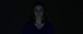 Movie still from “The Circle” (2017), directed by James Ponsoldt – A woman with dark hair is standing in the dark; Close Up shot, Low angle
