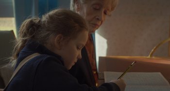 Movie still from “Petite Maman” (2021), directed by Céline Sciamma – Close Up shot, Over the shoulder angle