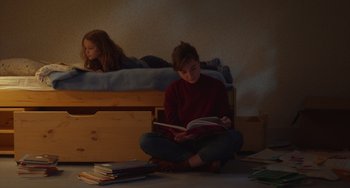 Movie still from “Petite Maman” (2021), directed by Céline Sciamma – Medium shot, High angle