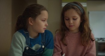 Movie still from “Petite Maman” (2021), directed by Céline Sciamma – Close Up shot, Over the shoulder angle