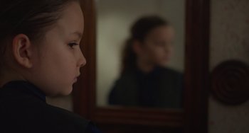 Movie still from “Petite Maman” (2021), directed by Céline Sciamma – Close Up shot, Over the shoulder angle