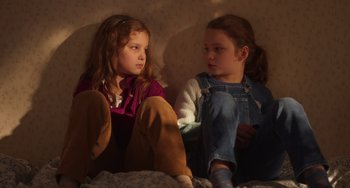 Movie still from “Petite Maman” (2021), directed by Céline Sciamma – Medium shot, High angle