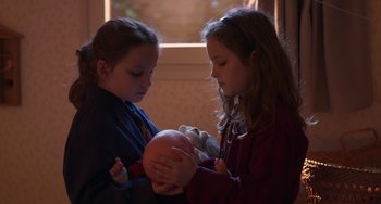 Movie still from “Petite Maman” (2021), directed by Céline Sciamma – Medium shot, High angle