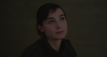 Movie still from “Petite Maman” (2021), directed by Céline Sciamma – A person looking at the camera; Close Up shot, High angle