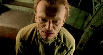 Movie still from “The City of Lost Children” (1995), directed by Jean-Pierre Jeunet – A person with his mouth wide open; Close Up shot, Low angle