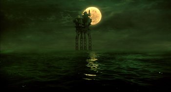 Movie still from “The City of Lost Children” (1995), directed by Jean-Pierre Jeunet – An oil rig in the middle of the ocean under a full moon at night; Extreme Wide shot, Low angle