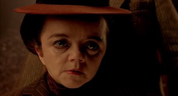 Movie still from “The City of Lost Children” (1995), directed by Jean-Pierre Jeunet – A person wearing a hat; Close Up shot, Low angle
