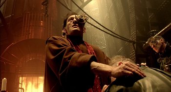 Movie still from “The City of Lost Children” (1995), directed by Jean-Pierre Jeunet – An old man with a telescope in his eyes; Medium shot, Low angle