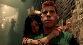 Movie still from “The City of Lost Children” (1995), directed by Jean-Pierre Jeunet – A man and a woman are hugging each other; Close Up shot, Low angle