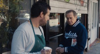 Movie still from “The Cobbler” (2014), directed by Tom McCarthy – Two men standing next to each other on the sidewalk; Medium shot, Over the shoulder angle