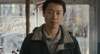 Movie still from “The Cobbler” (2014), directed by Tom McCarthy – A person wearing a jacket; Close Up shot, Low angle