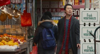 Movie still from “The Cobbler” (2014), directed by Tom McCarthy – A man and a woman walking down a street; Medium shot, Over the shoulder angle