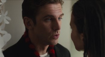Movie still from “The Cobbler” (2014), directed by Tom McCarthy – A person wearing a scarf looking into a mirror; Close Up shot, Over the shoulder angle