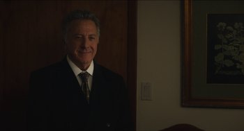 Movie still from “The Cobbler” (2014), directed by Tom McCarthy – A man in a suit and tie standing in front of a mirror; Medium shot, Over the shoulder angle