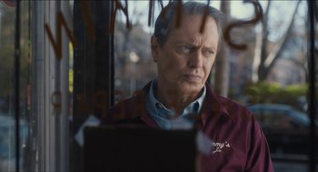 Movie still from “The Cobbler” (2014), directed by Tom McCarthy – An older man looking out of a bus window; Close Up shot, Over the shoulder angle