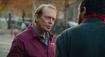 Movie still from “The Cobbler” (2014), directed by Tom McCarthy – A man in a purple jacket talking to another man in a purple jacket; Close Up shot, Over the shoulder angle
