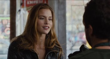 Movie still from “The Cobbler” (2014), directed by Tom McCarthy – A beautiful young lady wearing a leather jacket; Close Up shot, Over the shoulder angle