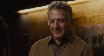 Movie still from “The Cobbler” (2014), directed by Tom McCarthy – An older man wearing a brown sweater and a plaid shirt; Close Up shot, Low angle
