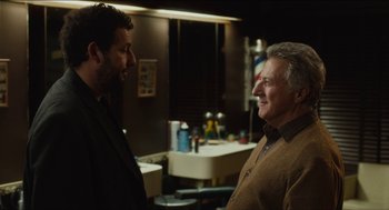 Movie still from “The Cobbler” (2014), directed by Tom McCarthy – Two men are talking in a room with a sink; Medium shot, Over the shoulder angle