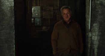 Movie still from “The Cobbler” (2014), directed by Tom McCarthy – A man standing in front of an electrical box; Medium shot, Low angle