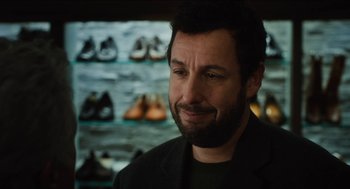 Movie still from “The Cobbler” (2014), directed by Tom McCarthy – A person wearing a suit and tie; Close Up shot, Over the shoulder angle