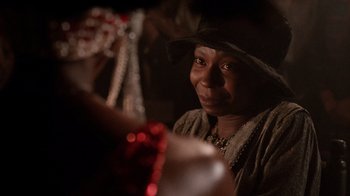 Movie still from “The Color Purple” (1985), directed by Steven Spielberg – An older black woman wearing a hat looking at the camera; Close Up shot, Over the shoulder angle