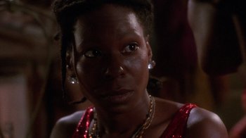 Movie still from “The Color Purple” (1985), directed by Steven Spielberg – A person wearing a necklace; Close Up shot, Over the shoulder angle