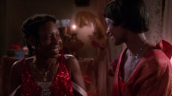 Movie still from “The Color Purple” (1985), directed by Steven Spielberg – Two women are talking to each other at a party; Close Up shot, Over the shoulder angle