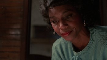 Movie still from “The Color Purple” (1985), directed by Steven Spielberg – An older black woman looking at the camera; Close Up shot, Low angle