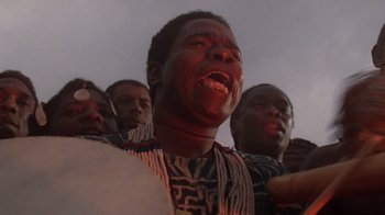 Movie still from “The Color Purple” (1985), directed by Steven Spielberg – A group of men standing next to each other; Close Up shot, Low angle