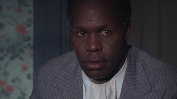 Movie still from “The Color Purple” (1985), directed by Steven Spielberg – A person wearing a jacket; Close Up shot, Low angle