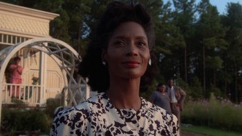Movie still from “The Color Purple” (1985), directed by Steven Spielberg – An older woman in a black and white floral dress; Close Up shot, Low angle
