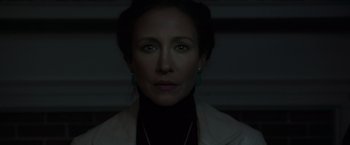 Movie still from “The Conjuring 2” (2016), directed by James Wan – A person wearing a white jacket; Close Up shot, Low angle