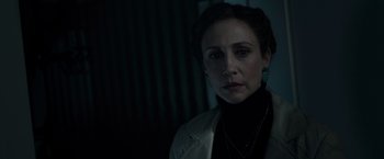 Movie still from “The Conjuring 2” (2016), directed by James Wan – A person wearing a black shirt; Close Up shot, Over the shoulder angle