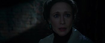 Movie still from “The Conjuring 2” (2016), directed by James Wan – A person looking at the camera; Close Up shot, Over the shoulder angle