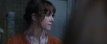 Movie still from “The Conjuring 2” (2016), directed by James Wan – A person wearing a sweater; Close Up shot, Over the shoulder angle