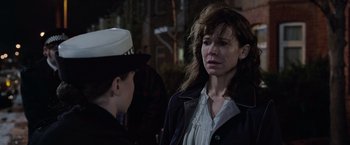 Movie still from “The Conjuring 2” (2016), directed by James Wan – A woman and a boy are standing in the dark; Close Up shot, Over the shoulder angle