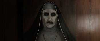 Movie still from “The Conjuring 2” (2016), directed by James Wan – A painting of a woman with a nun's face; Close Up shot, High angle