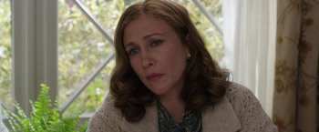 Movie still from “The Conjuring 2” (2016), directed by James Wan – A person wearing a sweater; Close Up shot, Over the shoulder angle