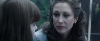 Movie still from “The Conjuring 2” (2016), directed by James Wan – A woman and a girl are talking to each other; Close Up shot, Over the shoulder angle