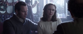 Movie still from “The Conjuring 2” (2016), directed by James Wan – A man and a woman sitting at a table in a restaurant; Close Up shot, Over the shoulder angle