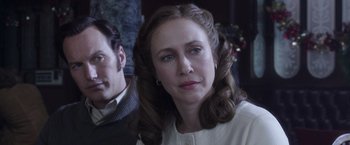 Movie still from “The Conjuring 2” (2016), directed by James Wan – A person wearing a white shirt; Close Up shot, Over the shoulder angle