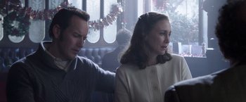 Movie still from “The Conjuring 2” (2016), directed by James Wan – A man and a woman sitting at a table in front of a window; Close Up shot, Over the shoulder angle