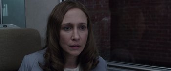 Movie still from “The Conjuring 2” (2016), directed by James Wan – A person with long brown hair; Close Up shot, Over the shoulder angle