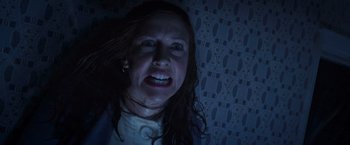 Movie still from “The Conjuring 2” (2016), directed by James Wan – A person in a dark room; Close Up shot, Overhead angle