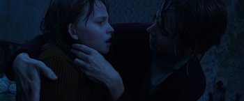 Movie still from “The Conjuring 2” (2016), directed by James Wan – A woman and a man are looking into each others eyes; Close Up shot, Over the shoulder angle