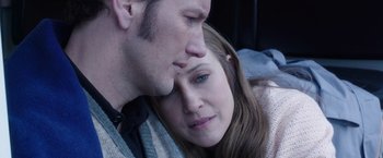 Movie still from “The Conjuring 2” (2016), directed by James Wan – A person laying on a bed with another person; Close Up shot, Overhead angle